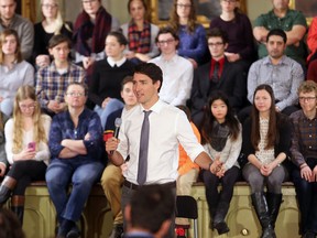 Prime Minister Justin Trudeau answers questions during his town hall meeting with about 265 people in Memorial Hall in Kingston's City Hall on Thursday January 12 2017.  Ian MacAlpine /The Whig-Standard/Postmedia Network
