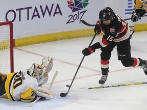 Senators’ Zack Smith tries to score on Penguins’ Matt Murray during first period  at the Canadian Tire Centre last night. (Tony Caldwell/Ottawa Sun)