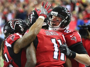 The Falcons, led by (from right) Matt Ryan, Julio Jones and Devonta Freeman, have the offence, but Randall the Handle is going with the post-season experience of the Seahawks in their match on Saturday. (Curtis Compton/AP)