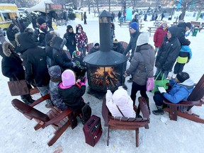 Ottawa’s world-famous Winterlude Festival will be held within a few weeks. Best-known about the festival is the Rideau Canal Skateway, said to be the world’s largest naturally frozen ice skating rink. Here, Winterlude celebrants take a break from the activities in this file photograph from 2015. File photo/Postmedia Network