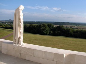 The sculpture of a grieving Young Canada, looking out over the Douai plain at the Vimy Memorial at Vimy, France. Locally, a cenotaph ceremony and commemorative dinner are planned for Sarnia on April 2 to mark the 100th anniversary of the Battle of Vimy Ridge. File photo/Postmedia Network