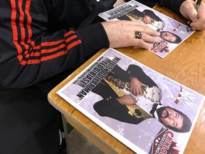 Wrestling legend and World Wrestling Entertainment Hall of Famer The Million Dollar Man Ted DiBiase signs autographs at Chinlock Wrestling's annual charity show in Kingston in December. (Jan Murphy/The Whig-Standard)