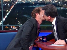 Colbert and Garfield smooch