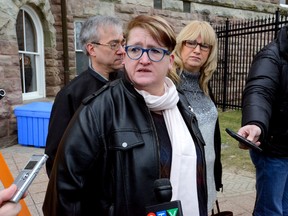 Laura Jackson talks with reporters outside the Woodstock courthouse after the appearance of Elizabeth Wettlaufer on Friday January 13, 2017. Jackson was a friend of a senior included in the suspicious deaths in the case. (MORRIS LAMONT, The London Free Press)