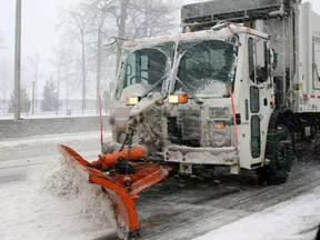 New York City Department of Sanitation garbage truck with snow plow attached.