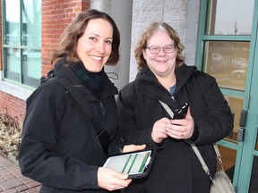 Carolyn Bonta, left, with the Elbow Lake Environmental Education Centre, and Debbie Fitzerman, with DFC International, in Kingston on Thursday have teamed up to host a series of nature workshops where people will learn to use their smartphones and tablets to research the wildlife they encounter. (Michael Lea/The Whig-Standard)