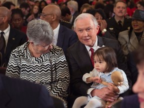 Sen. Jeff Sessions, centre, sits next to his wife Mary and their granddaughter, prior to the Senate Judiciary Committee hearings on Sessions' nomination to be Attorney General on January 10, 2017 in Washington, D.C. (MOLLY RILEY/AFP/Getty Images)