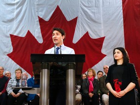 Prime Minister Justin Trudeau responds to questions from reporters next to MP Maryam Monsef after speaking to a packed banquet hall at the Evinrude Centre on Friday January 13, 2017 in Peterborough, Ont. at a town hall meeting that covered topics such as safe drinking water for First Nation communities, hydro rates and carbon taxes. Clifford Skarstedt/Peterborough Examiner/Postmedia Network