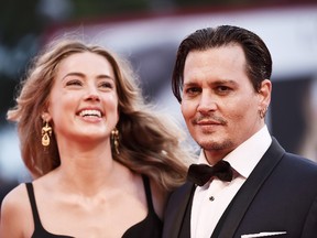 Johnny Depp and Amber Heard attend a premiere for 'Black Mass' during the 72nd Venice Film Festival at on September 4, 2015 in Venice, Italy. (Ian Gavan/Getty Images)
