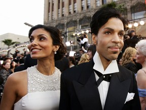 In this Feb. 27, 2005 file photo, singer Prince arrives with his wife Manuela Testolini for the 77th Academy Awards in Los Angeles. Records from the late megastar’s divorce from Testolini were unsealed Friday, Jan. 13, 2017, by a judge’s order. The Minneapolis Star Tribune went to court to unseal the files, which show Testolini said the couple threw lavish parties after major awards shows. The couple’s divorce was granted in 2007. Prince died of an accidental painkiller overdose on April 21, 2016. (AP Photo/Kevork Djansezian, File)
