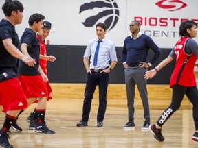 Masai Ujiri and Prime Minister Justin Trudeau watched 10 children from La Loche, SK, have a great time on Friday. Ernest Doroszuk/Postmedia