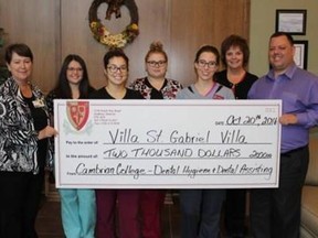 Jaime Huard, second left, Sara Coish, Britni Eliis, Justine Perfetto and Heather McKenzie, an instructor from the Cambrian College Dental Hygiene and Dental Assistant programs, presented a cheque in the amount of $2,000 to Ray Ingriselli, site administrator and Claire Vincent-Viau, left, volunteer co-ordinator at St. Gabriel Villa. Supplied photo