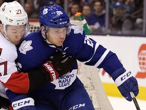Toronto Maple Leafs Ben Smith battles against the Ottawa Senators Curtis Lazar in Toronto on Saturday March 5, 2016. (Craig Robertson/Postmedia Network File Photo)