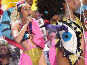 Wayne Coyne of The Flaming Lips (L) and host Miley Cyrus perform onstage during the 2015 MTV Video Music Awards at Microsoft Theater on Aug. 30, 2015 in Los Angeles.  (Kevork Djansezian/Getty Images)