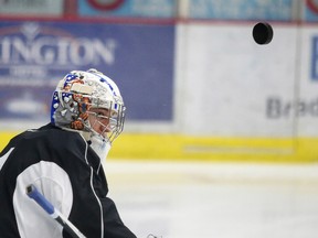 Sudbury Wolves goalie Jake McGrath wears his new helmet during team practice in Sudbury, Ont. on Thursday December 1, 2016. Gino Donato/Sudbury Star/Postmedia Network