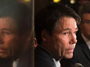 Ontario Health Minister Eric Hoskins speaks with reporters during a break in meetings at the Finance Ministers meeting in Ottawa, December 19, 2016. THE CANADIAN PRESS/Adrian Wyld