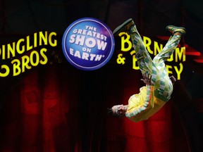 A Ringling Bros. and Barnum & Bailey clown does a somersault during a performance Saturday, Jan. 14, 2017, in Orlando, Fla. The Ringling Bros. and Barnum & Bailey Circus will end the "The Greatest Show on Earth" in May, following a 146-year run of performances. Kenneth Feld, the chairman and CEO of Feld Entertainment, which owns the circus, told The Associated Press, declining attendance combined with high operating costs are among the reasons for closing. (AP Photo/Chris O'Meara)