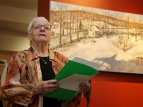 Pauline Winkle, a long-time gallery volunteer, reads a poem aloud on Saturday Saturday January 14, 2017 at Gallery 121. It was the same poem she read in 1991 when the non-profit, co-operative gallery was first opened in Belleville, Ont. 

Emily Mountney-Lessard/Belleville Intelligencer/Postmedia Network