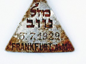 This undated photograph released by the Israel Antiquities Authority shows a pendant that appears identical to one belonging to Anne Frank, Israel’s Yad Vashem Holocaust memorial said Sunday. (Yoram Haimi, Israel Antiquities Authority via AP)