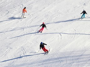 Emily Mountney-Lessard/The Intelligencer
Skiers make their way down the hill at Batawa Ski Hill Sunday.
