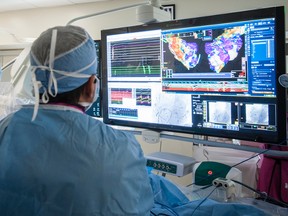 Dr. Ben Glover, left, uses the EnSite Precision cardiac mapping system while treating a patient at Kingston General Hospital on Jan. 5. (Photo supplied by KGH)