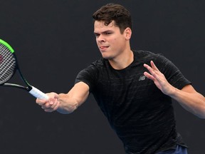 Canada's Milos Raonic hits a return during a practice session ahead of the Australian Open tennis tournament in Melbourne on January 15, 2017. (AFP PHOTO)