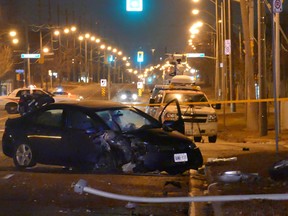 Toronto police say a vehicle struck a light pole in the west end of the city on Sunday at around 8:30 p.m. Investigators say a man who was injured in the crash also had a gunshot wound to the neck. (PASCAL MARCHARD/SPECIAL TO THE SUN)