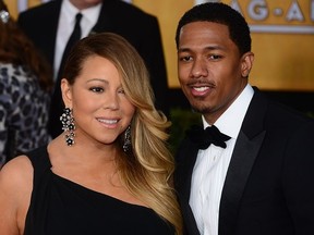 Singer Mariah Carey and husband Nick Cannon attend the 20th annual Screen Actors Guild (SAG) Awards on January 18, 2014 at the Shrine Auditorium in Los Angeles. (FREDERIC J. BROWN/AFP/Getty Images)