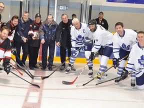 For the ceremonial face-off before the game, Hawks’ Don Vipond (fifth from left), initial captain from 1966-67; original player and current executive member Barry Dietz, original trainer Fred Phillips and original player Charlie Robertson drop the ceremonial pucks with more recent former Hawks’ captains Kyle Verberne (foreground, left), Trevor Harmer, Jeff Smith and Kevin Baetz and Leaf alumnus Rick Vaive. Also pictured are three Mitchell area Leaf fans who played with the visitors, Joe Gethke, Shayne McClure and Dave Chessell. ANDY BADER MITCHELL ADVOCATE