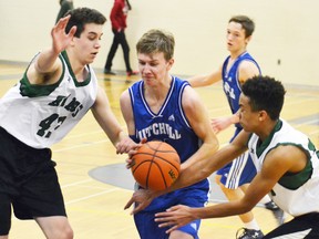 Jack Dixon (middle) of the MDHS junior boys basketball team tries to keep the ball away from the Stratford Central Rams’ defense during junior boys basketball action last Wednesday, Jan. 11. The Blue Devils lost, 58-27. GALEN SIMMONS MITCHELL ADVOCATE