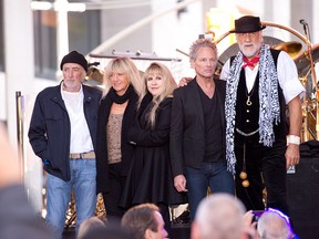(L-R) John McVie, Christine McVie, Stevie Nicks, Lindsey Buckingham and Mick Fleetwood of Fleetwood Mac pose on stage on NBC's 'Today' at the NBC's TODAY Show on October 9, 2014 in New York, New York. (Photo by Noam Galai/Getty Images)