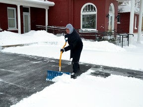 West Perth and much of the province was hit with yet another winter storm last Tuesday, Jan. 10, when a Colorado low made its way north into Canada, bringing with it snow, high winds, freezing rain and rain. Pictured, Stuart Lender shovels the driveway at Lockhart Funeral Home for the fourth time since he began work Jan. 10. GALEN SIMMONS MITCHELL ADVOCATE