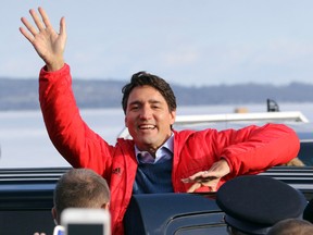 Prime Minister Justin Trudeau waves goodbye following a stop at Rhino's Roadhouse in Bewdley, Ont., on Friday Jan. 13, 2017. (Pete Fisher/Northumberland Today/Postmedia Network)
