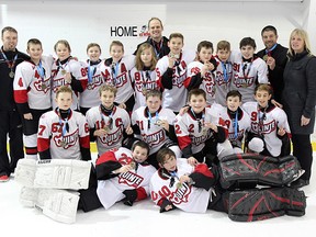 The Bonn Law peewee minor Quinte Red Devils celebrate after winning their division title at the Limestone City Cup tournament in Kingston. Back row from left: Pat Cousins (trainer), Joshua Cunningham, Benjamin Lynch, Nick Oke, Duncan Schneider, Sidney Wakley, Brandon McLean (assistant coach), Ethan Miedema, Jack Dever, Will Potts, Christopher Brydges, Tyler Longo (assistant coach) and Jeanna Oke (head coach). Middle: Vincent Bellavance, Cal Uens, Spencer Cranley, Ethan Quick, Jack Lowry and Michael Dolton. In front: Aidan Crowley and Logan Vale. (Submitted photo)