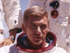 In an undated file photo provided by NASA, U.S. Navy Commander and Astronaut for the upcoming Apollo 17, Eugene Cernan, is pictured in his space suit. (NASA via AP)