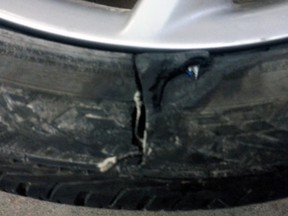 Lori Cameron's tire was blown by a pothole on Highway 401 in Kingston on Thursday. (Supplied photo)