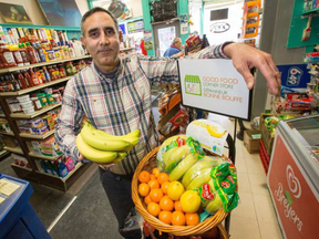 Owner Jasvir Dhillon of the Preston Food Market on Preston Street is selling fresh bananas, potatoes, other fruits and veggies as part of a new Ottawa Public Health initiative to get healthy food options in corner stores. (WAYNE CUDDINGTON / POSTMEDIA)