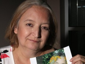 Judi Coyle holds a photo of her daughter Kassidi. (TRACY MCLAUGHLIN PHOTO)