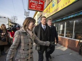 Councillor Mary-Margaret McMahon (front) and Mayor John Tory (behind her) are pictured on Queen St. E. (ERNEST DOROSZUK, Toronto Sun)