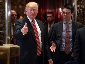 President-elect Donald Trump gives a thumbs up to members of the media at Trump Tower in New York, Monday, Jan. 16, 2017. (AP Photo/Andrew Harnik)