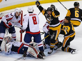 Pittsburgh Penguins' Sidney Crosby begins to celebrate a game-winning goal in OT during an NHL game against the Washington Capitals on Jan. 16, 2017. (AP Photo/Gene J. Puskar)