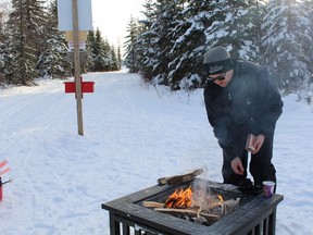 Kellen David starts the fire that was used for the Festive ski recently.