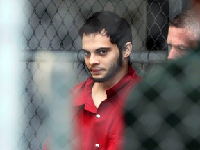 In this Jan. 9, 2017, file photo, Esteban Santiago is taken from the Broward County jail as he is transported to the federal courthouse in Fort Lauderdale, Fla. (Amy Beth Bennett/South Florida Sun-Sentinel via AP, File)
