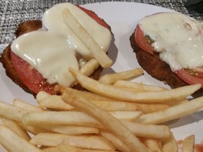 Swiss schnitzel with tomato slices and (processed) Swiss cheese