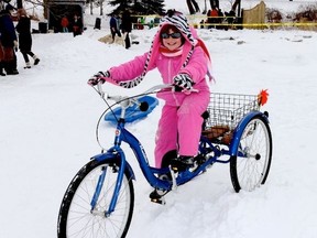 Intelligencer file photo
Gabrielle Kinnear of Cherry Valley enjoyed a spin around the Mill Pond on a three-wheeled bike on Saturday during the Milford Winter Carnival two years ago. The popular winter carnival will take place later this month.