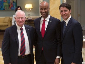 Governor General David Johnston and Prime Minister Justin Trudeau pose with Ahmed Hussen, Minister of Immigration, Refugees and Citizenship during a cabinet shuffle at Rideau Hall in Ottawa, January 10, 2017. (THE CANADIAN PRESS/Adrian Wyld)
