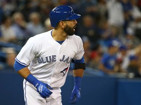 Blue Jays batter Jose Bautista hits a two-run home run against the Rays at the Rogers Centre in Toronto on May 17, 2016. Bautista appears to be returning to the Blue Jays for the 2017 season. (Dave Abel/Toronto Sun/Files)
