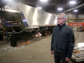 Bob Clark, contracts manager of MetalCraft Marine, looks at the upside down hull of a Firestorm 50 fire boat that is one of three boats going to the Istanbul Turkey Fire Department. (Ian MacAlpine /The Whig-Standard)