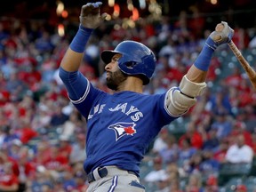 Jose Bautista of the Toronto Blue Jays hits a three run home run to left field agianst Jake Diekman of the Texas Rangers during the ninth inning in game one of the American League Divison Series at Globe Life Park. (Ronald Martinez/Getty Images)