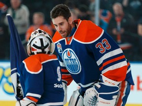 Edmonton Oilers goaltender Cam Talbot chats with Scotiabank Skater Kaden Lutgen before the puck dropped against the New Jersey Devils at Rogers Place on Jan. 12, 2017. (Ian Kucerak)